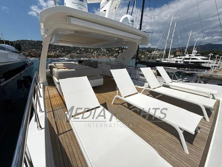  Yacht Photos Pics Luxurious 2019 Azimut Fly 72 yacht deck with sun loungers and scenic marina view.