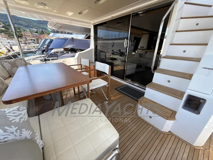  Yacht Photos Pics Luxurious 2019 Azimut Fly 72 yacht deck with seating and stairs, docked at marina.