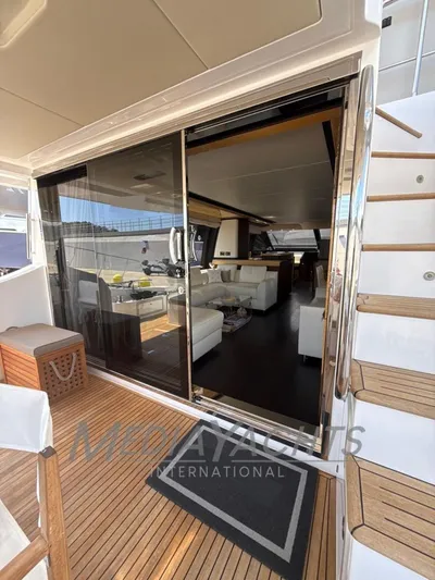  Yacht Photos Pics Luxurious 2019 Azimut Fly 72 yacht interior with elegant seating and wooden deck.