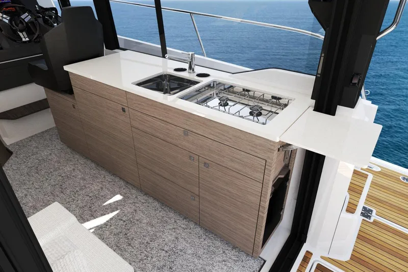  Yacht Photos Pics Manufacturer Provided Image: Modern kitchen area on 2025 Jeanneau NC 1095 Coupe Series 2 yacht, featuring sleek design.