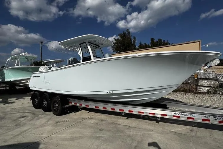  Yacht Photos Pics 2026 Sportsman Heritage 261 Center Console boat on trailer under blue sky.
