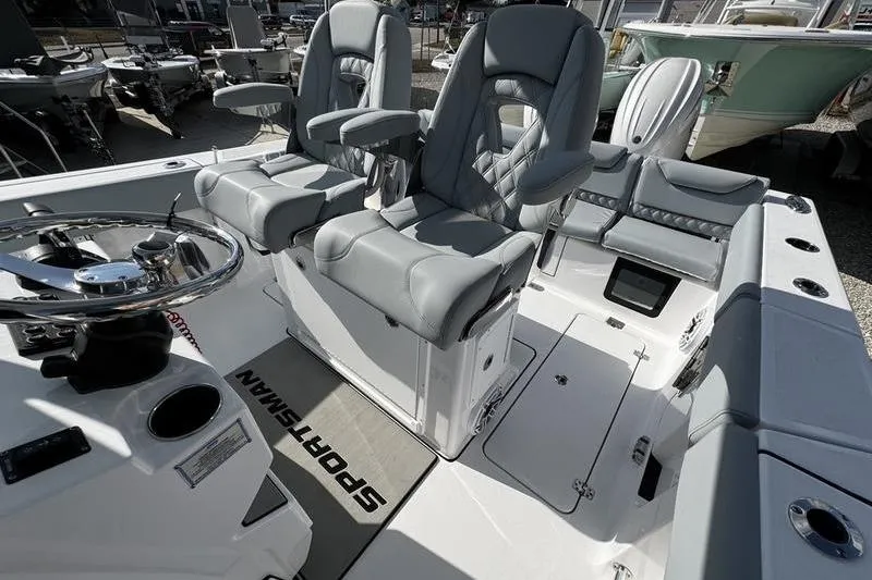  Yacht Photos Pics 2026 Sportsman Heritage 261 Center Console boat interior with gray seating and steering wheel.