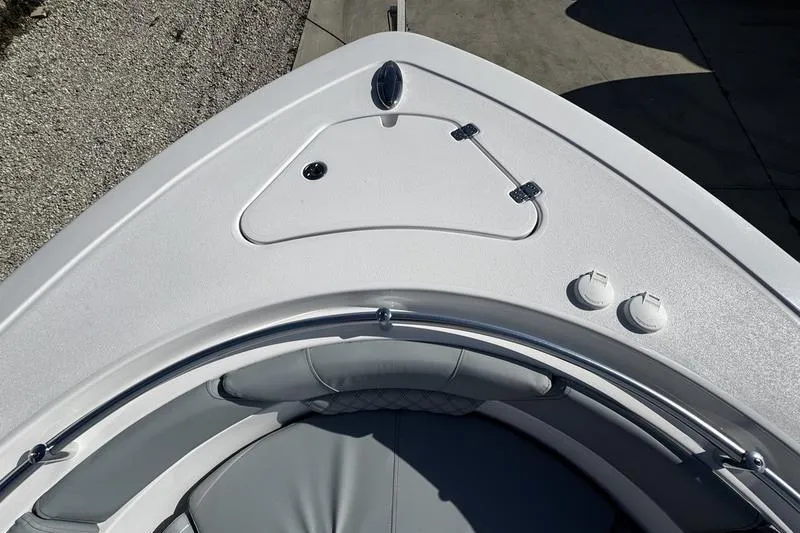  Yacht Photos Pics 2026 Sportsman Heritage 261 Center Console boat bow with seating and storage compartments.