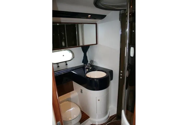  Yacht Photos Pics Luxurious bathroom in 2000 Princess 56 yacht with modern fixtures and elegant design.