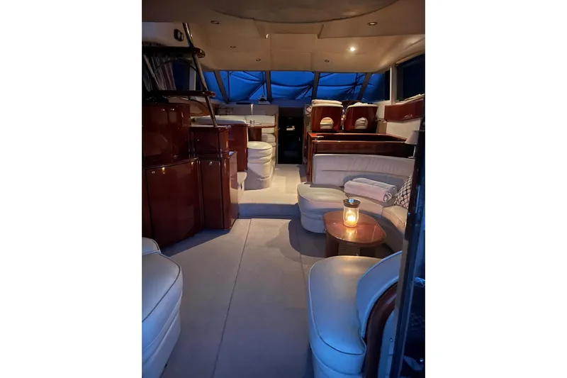  Yacht Photos Pics Luxurious interior of a 2000 Princess 56 yacht with elegant seating and ambient lighting.