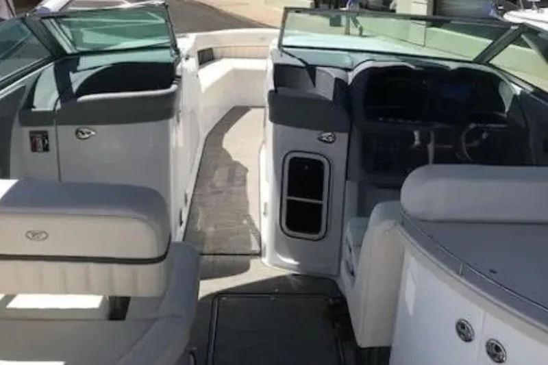  Yacht Photos Pics Interior view of a 2018 Cobalt R35 boat, featuring seating and dashboard.