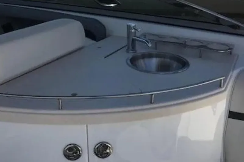  Yacht Photos Pics 2018 Cobalt R35 boat interior with sink and cup holders.