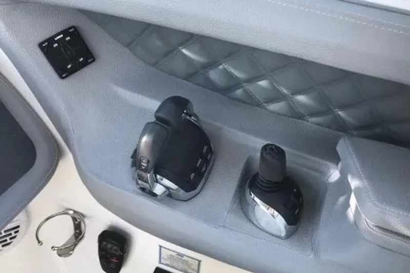  Yacht Photos Pics Control panel of a 2018 Cobalt R35 boat with throttle and joystick.