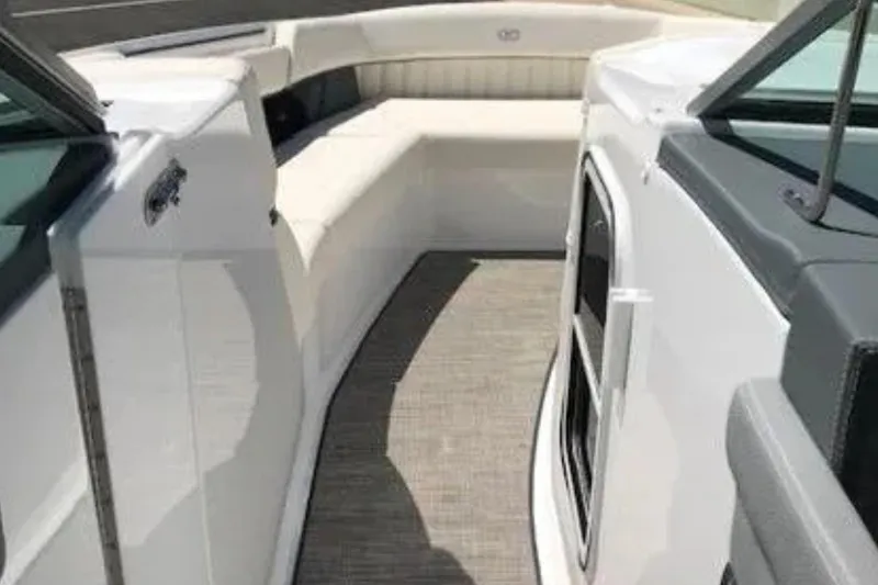  Yacht Photos Pics 2018 Cobalt R35 boat interior with white seating and carpeted floor.