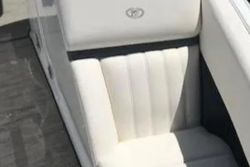 Yacht Photos Pics White leather seat in a 2018 Cobalt R35 boat, featuring elegant stitching.