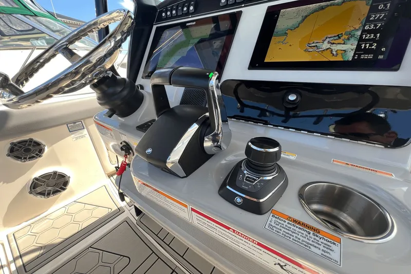  Yacht Photos Pics 2024 Boston Whaler 280 Outrage helm with navigation display and controls.