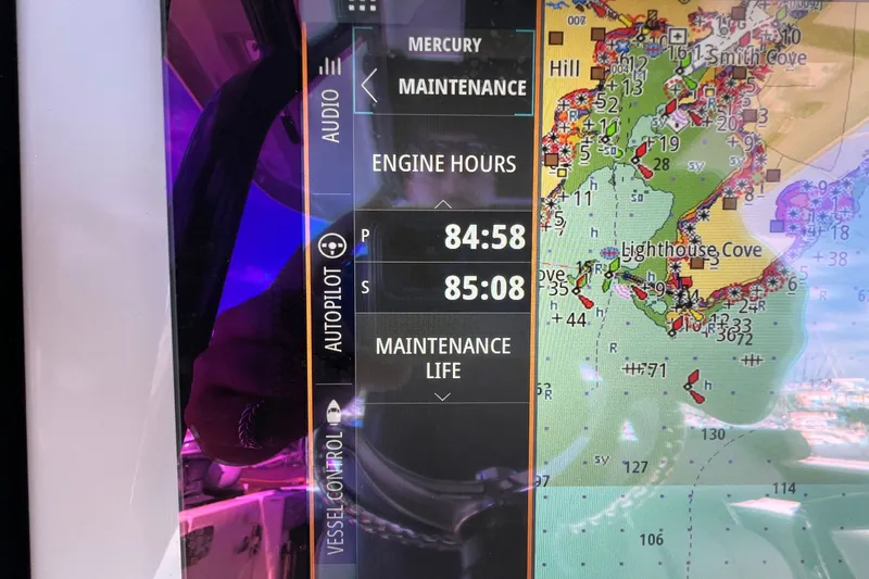  Yacht Photos Pics Navigation display on 2024 Boston Whaler 280 Outrage showing engine hours and map.