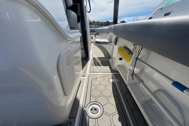  Yacht Photos Pics 2024 Boston Whaler 280 Outrage interior with hexagonal flooring and storage compartments.