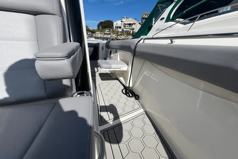  Yacht Photos Pics 2024 Boston Whaler 280 Outrage interior with gray seating and modern design elements.