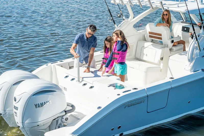  Yacht Photos Pics Manufacturer Provided Image: Family enjoying a 2025 Pursuit DC 306 Dual Console boat on the water.