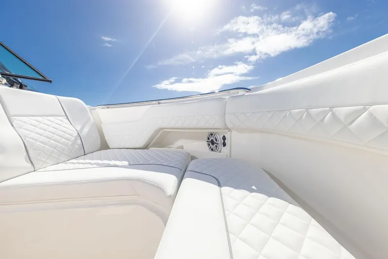  Yacht Photos Pics Manufacturer Provided Image: Luxurious seating on 2025 Pursuit DC 306 Dual Console boat under sunny sky.