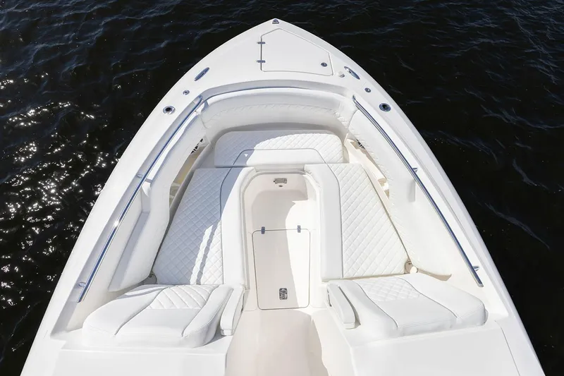  Yacht Photos Pics Manufacturer Provided Image: 2025 Pursuit DC 306 Dual Console boat, white seating, sleek design, on dark water.