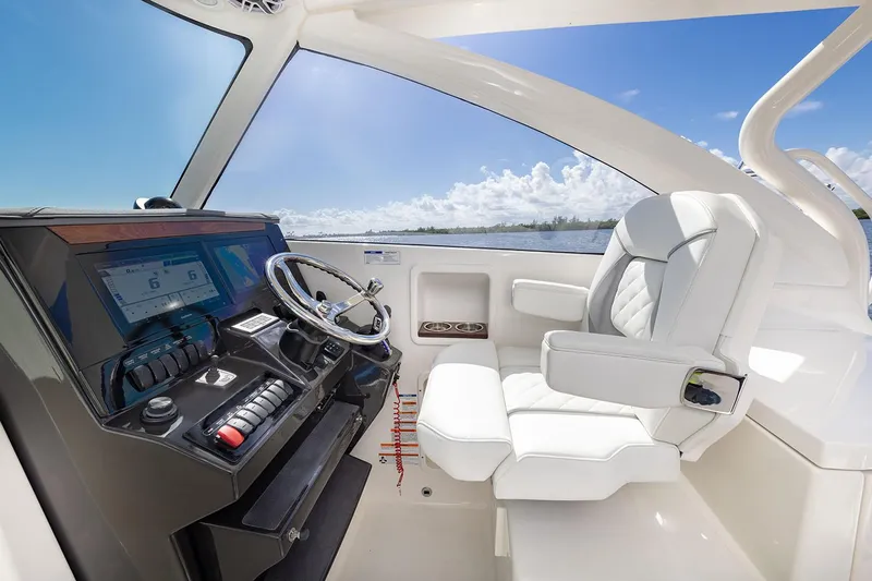  Yacht Photos Pics Manufacturer Provided Image: 2025 Pursuit DC 306 Dual Console interior with modern helm and luxurious seating.