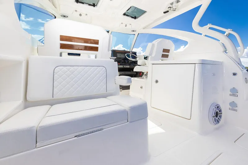  Yacht Photos Pics Manufacturer Provided Image: Luxurious interior of 2025 Pursuit DC 306 Dual Console boat with white seating.