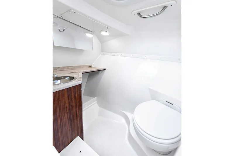  Yacht Photos Pics Manufacturer Provided Image: 2025 Pursuit DC 306 Dual Console boat bathroom with sink and toilet.