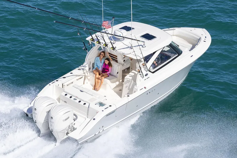  Yacht Photos Pics Manufacturer Provided Image: 2025 Pursuit DC 306 Dual Console boat cruising on open water.