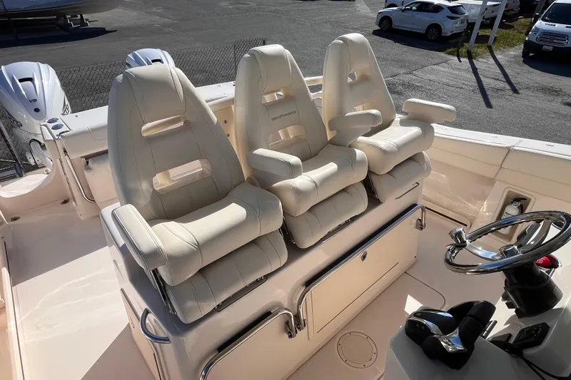  Yacht Photos Pics 2022 Grady-White Canyon 336 boat with three luxurious helm seats and steering wheel.