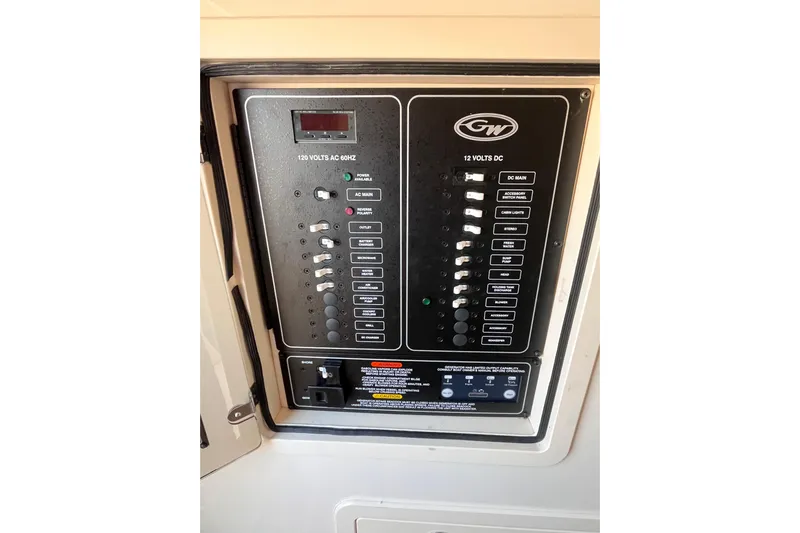  Yacht Photos Pics Electrical panel of 2022 Grady-White Canyon 336 boat, featuring AC and DC controls.