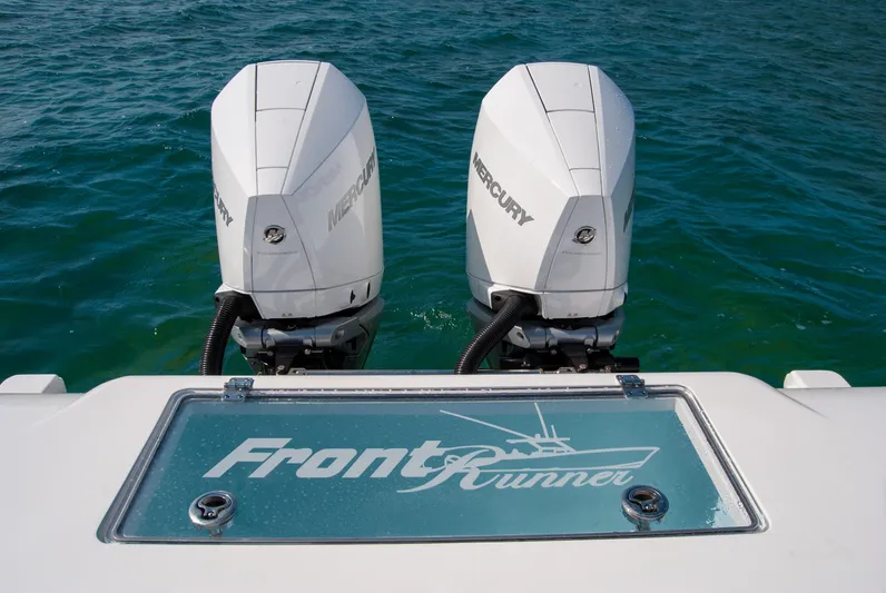  Yacht Photos Pics 2023 Front Runner 33 Center Console with twin Mercury outboard engines on blue water.