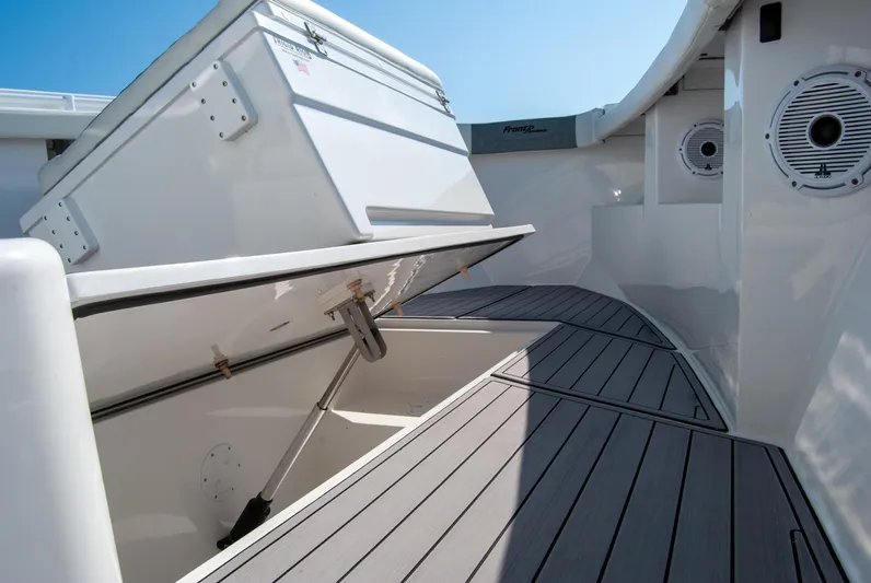  Yacht Photos Pics 2023 Front Runner 33 Center Console boat interior with storage compartment open.