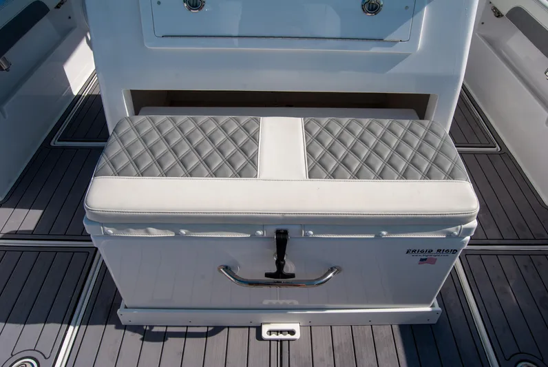  Yacht Photos Pics 2023 Front Runner 33 Center Console boat seat with quilted cushion and storage.