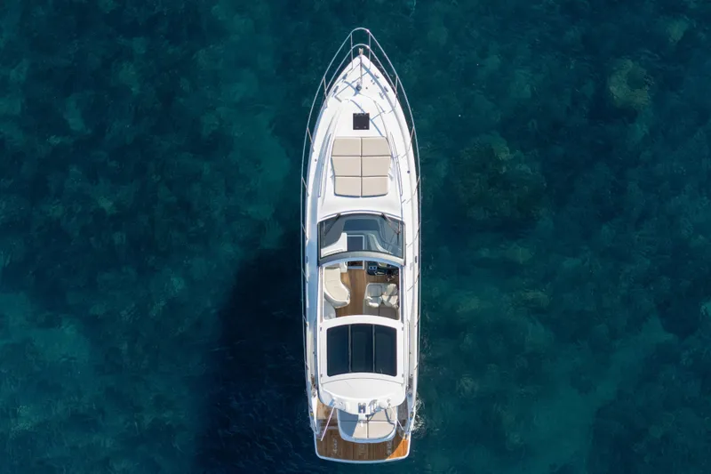 V50 Open Yacht Photos Pics Aerial view of 2026 Princess V50 Open yacht on clear blue water.