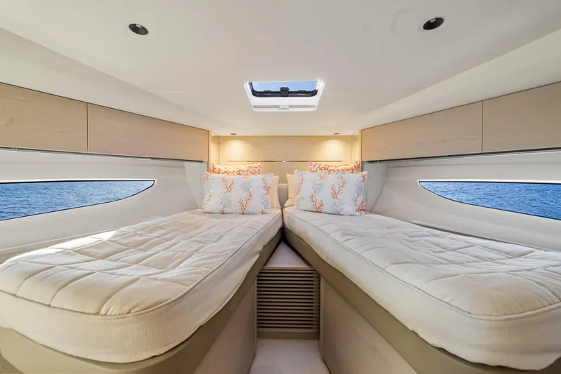 V50 Open Yacht Photos Pics Luxurious interior of 2026 Princess V50 Open yacht with twin beds and ocean view.