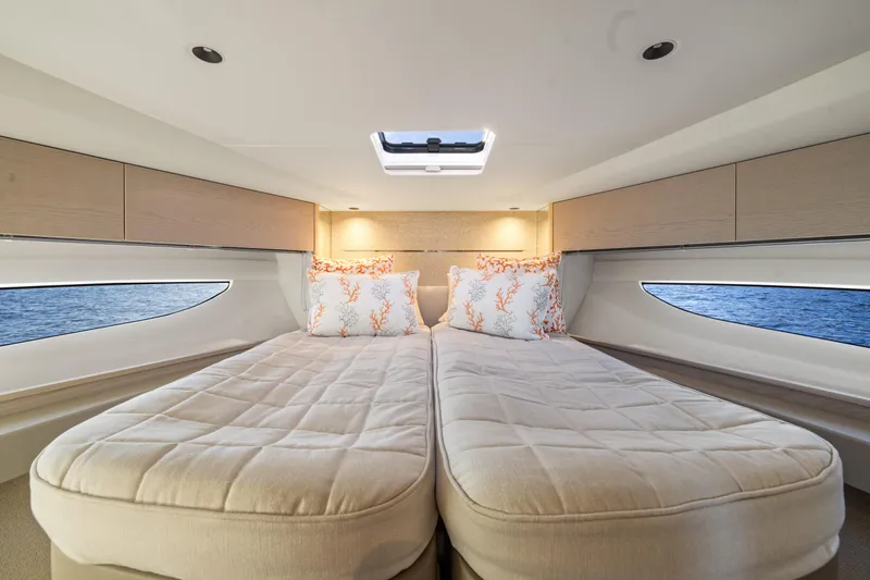 V50 Open Yacht Photos Pics Luxurious cabin interior of 2026 Princess V50 Open yacht with twin beds and ocean view.