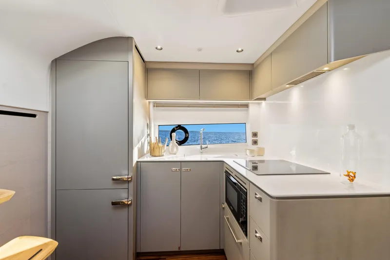 V50 Open Yacht Photos Pics Modern kitchen interior of 2026 Princess V50 Open yacht with ocean view.
