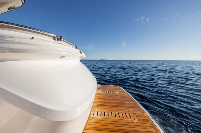 V50 Open Yacht Photos Pics 2026 Princess V50 Open yacht on calm sea with clear blue sky.