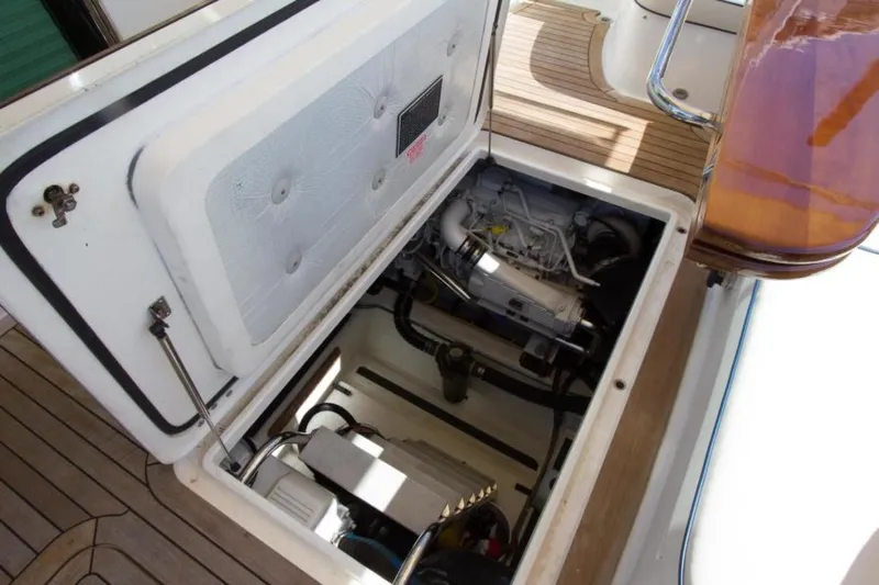 Ohana Yacht Photos Pics Engine compartment of 2016 Sabre Flybridge boat, showcasing mechanical components and storage.