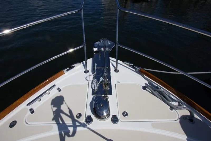 Ohana Yacht Photos Pics Bow of 2016 Sabre Flybridge yacht with anchor and railing.