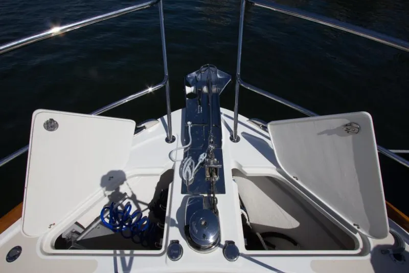 Ohana Yacht Photos Pics 2016 Sabre Flybridge boat deck with open storage compartments and railing.