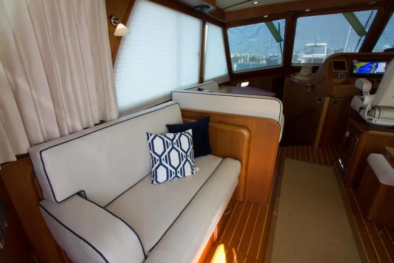 Ohana Yacht Photos Pics Interior of 2016 Sabre Flybridge yacht with elegant seating and nautical decor.