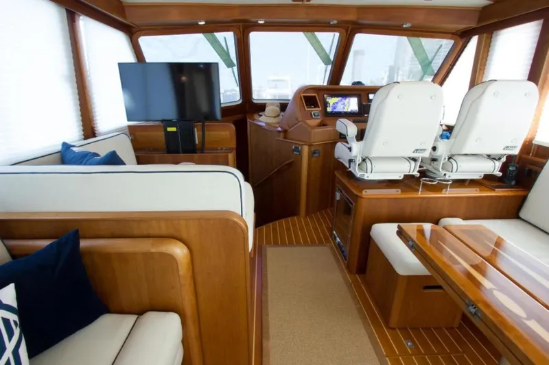 Ohana Yacht Photos Pics Interior of 2016 Sabre Flybridge yacht with luxurious seating and modern navigation equipment.
