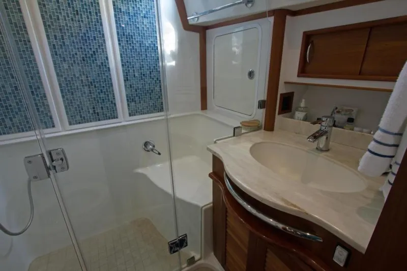 Ohana Yacht Photos Pics Luxurious 2016 Sabre Flybridge bathroom with modern fixtures and elegant design.