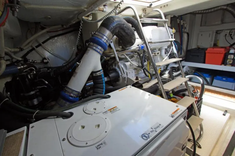 Ohana Yacht Photos Pics Engine room of 2016 Sabre Flybridge yacht with visible machinery and equipment.