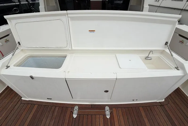  Yacht Photos Pics 2023 Maritimo M600 yacht deck with sink and storage compartments.