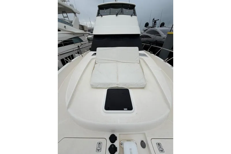  Yacht Photos Pics 2023 Maritimo M600 yacht deck with cushioned seating and sleek design.