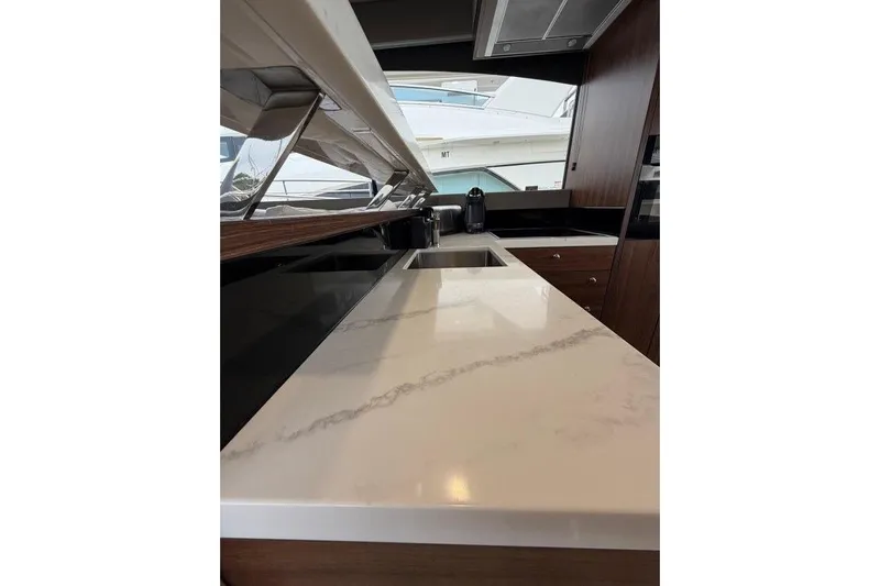  Yacht Photos Pics Luxurious kitchen interior of 2023 Maritimo M600 yacht with sleek countertops.