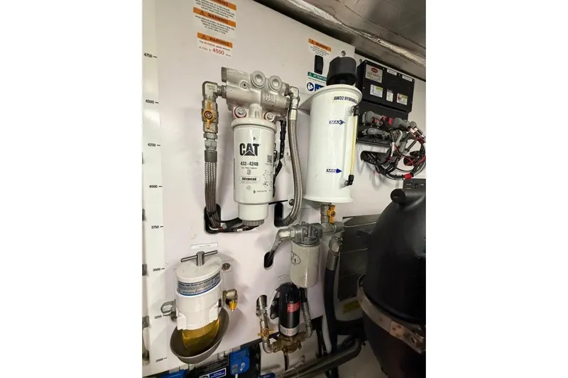  Yacht Photos Pics Engine room of 2023 Maritimo M600 yacht with CAT and Racor fuel filters.