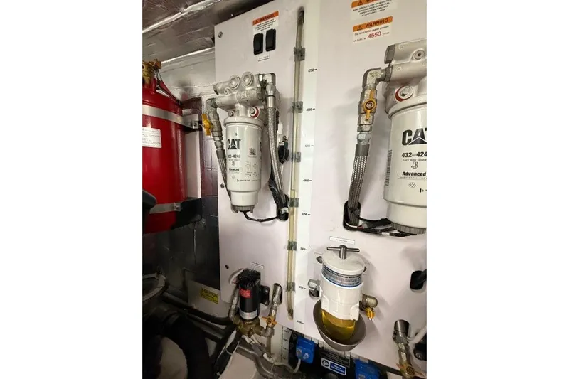  Yacht Photos Pics Engine room of 2023 Maritimo M600 yacht with CAT fuel filters and equipment.