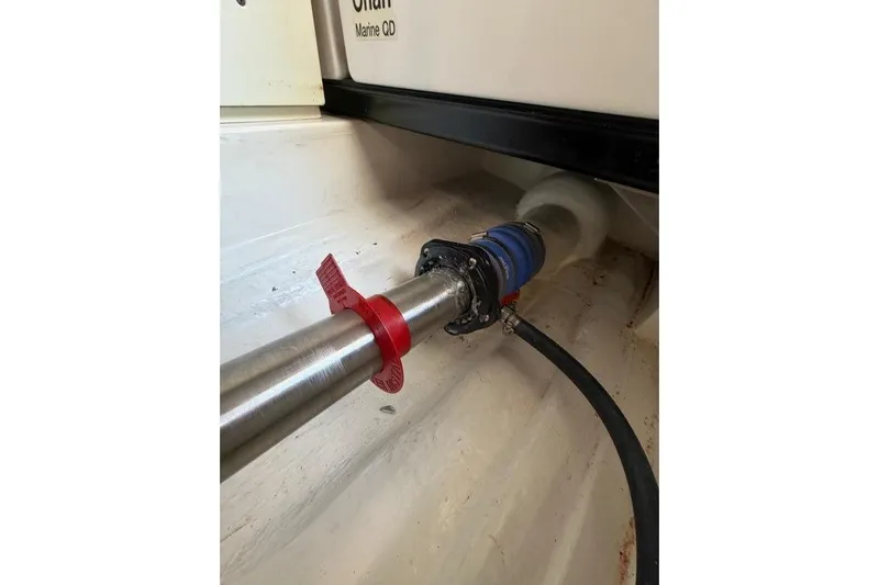  Yacht Photos Pics 2023 Maritimo M600 engine compartment with metal pipe and red valve.