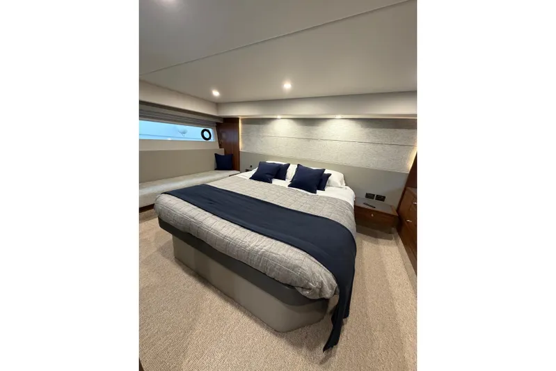  Yacht Photos Pics Luxurious bedroom interior of 2023 Maritimo M600 yacht with elegant bedding and modern design.