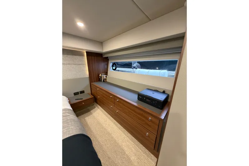  Yacht Photos Pics Luxurious interior of 2023 Maritimo M600 yacht with sleek wood cabinetry and modern decor.
